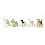 Five Beswick dog ornaments, comprising Dalmatian, Lakeland Terrier, white Poodle, Chow and a Cocker