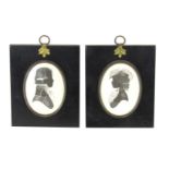 Two silhouettes, both signed Enid Elliott Linder, in ornate frames with brass acorn top and loops, 1