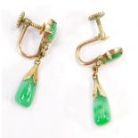 A pair of jade drop earrings, each with tear drop design cut jade piece and a circular jade stud, in