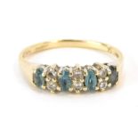 A 9ct gold half hoop dress ring, set with four aquamarines and six cz stones, ring size O, 2g all in