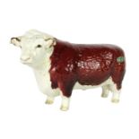 A Beswick Hereford Bull Champion, with silver and green Beswick stamp, 10cm high, boxed.