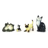 Four Beswick cat ornaments, comprising a large grey Tabby cat, No 1030, 15cm high, a pair of Tabby k
