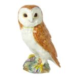 A John Beswick model of a Barn Owl, on stone perch, 19cm high, boxed.