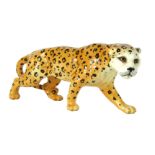 A Beswick leopard, on the prowl, with black Beswick England, stamped to underside, 30cm wide.