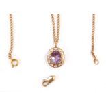 A 9ct gold amethyst pendant and chain, the oval pendant with heart shaped outer border and oval cut