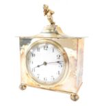 An early 20thC silver plated mantel clock, with timepiece movement, white enamel dial having black h