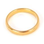 A 22ct gold wedding band, of plain design, ring size M½, 3.3g all in.