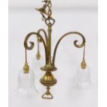 A brass three branch hanging chandelier, with chain drop, on stem and fluted bulbous centre, with fl