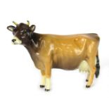 A Beswick Jersey Cow Champion Newton Tinkle, 10cm high, boxed.