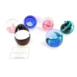 Six Caithness glass paperweights, comprising The Commemorative Millennium paperweight, Steel Blue, M
