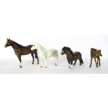 A group of horse figures, comprising a Beswick Connemara, a brown Beswick Stallion, a Beswick Shetla