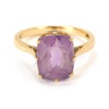 A 9ct gold amethyst dress ring, with rectangular cut amethyst in claw setting, on a plain band, ring