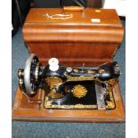 A Jones Sewing machine, in wooden carry case.