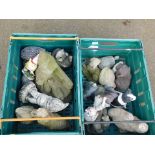 Two boxes of mixed garden ornaments.