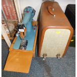 An Alfa sea blue sewing machine, c1960's, in light wood carry case.