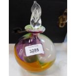 A Mdina Art Glass decanter and stopper, in purple, green and orange.