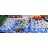A group of drinking glasses, coloured glass, stone vases, etc. (3 trays)