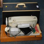 A Merritt cased sewing machine.