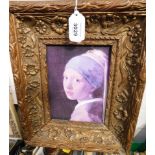 After Vermeer. The Girl With A Pearl Earring, print on canvas, within a 19thC ornate floral gilt f