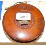 A Dring & Fage Board of Trade tape measure, in leather casing, 56 Stamford Street, London.