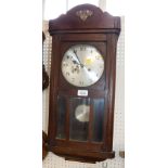 A 1930's/1940's oak cased chiming wall clock, the silvered dial with blue hands and thirty one hour