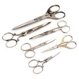 Six pairs of antique and vintage haberdashery and sewing scissors.