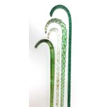 Four Nailsea glass walking canes, three spiral fluted, the other of undecorated form, 24cm-106cm hig