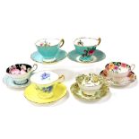 Six Shelley and Paragon porcelain floral teacups and saucers, variously decorated.