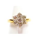 An 18ct gold and diamond flower head ring, of six petal form, each set with seven brilliant cut diam