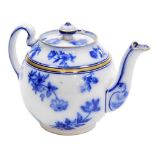 A Macintyre and Co teapot and cover, of bullet shaped form, decorated with blue transfer printed flo