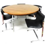 A vintage mid century circular rosewood dining table, raised on steel supports, 72.5cm high, 137cm d