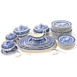 A Wedgwood pottery Willow pattern blue and white dinner service, comprising five graduated meat plat
