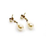 A pair of 9ct gold cultured pearl drop earrings, each with a pearl drop and pearl stud with gold cha