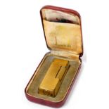 A Dunhill gold plated pocket lighter, boxed.