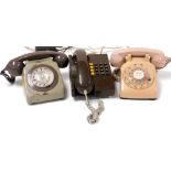 A two tone dial telephone, in salmon pink and tan, further two dial telephone in brown and olive gre