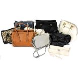 A group of lady's handbags, to include a leopard print style handbag, faux leather tanned shoulder b