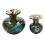 A 20thC Mdina glass vase, of shouldered form with a flared rim, with swirled green and amber coloure