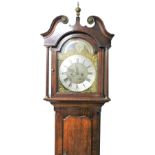 A George III mahogany and oak long case clock by Samuel Fletcher of Dewsbury, the break arched dial