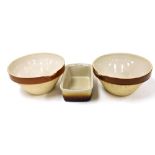 A pair of brown glazed pottery farmhouse dairy creaming bowls, 32cm diameter, together with a French