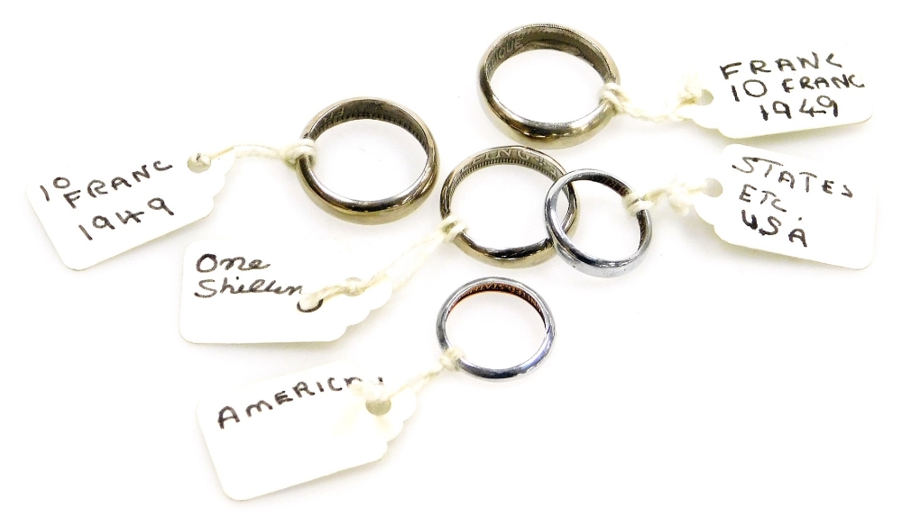 Five artisan made coin rings, formed from a French 1949 ten francs, a British one shilling, American