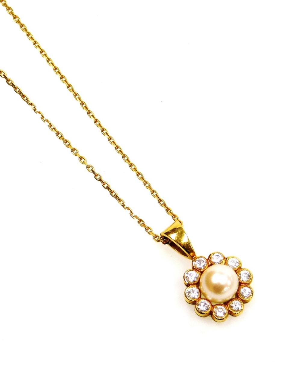 An 18ct gold pearl and diamond cluster pendant, with central cultured pearl surrounded by tiny diamo