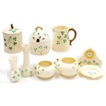 A group of Belleek pottery decorated in the Shamrock pattern, various back stamps, including a mante