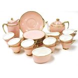 An early 20thC Royal Doulton porcelain tea service, pink ground with gilt edged rim, painted and pri