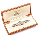 An Art Deco diamond brooch, set with old cut diamonds, in white metal, boxed, 6.8g.