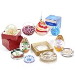 A group of glass paperweights, to include a Caithness Fizz Bomb paperweight, decorated with a multi-