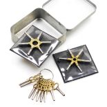 A group of watch keys, to include two star shaped examples.