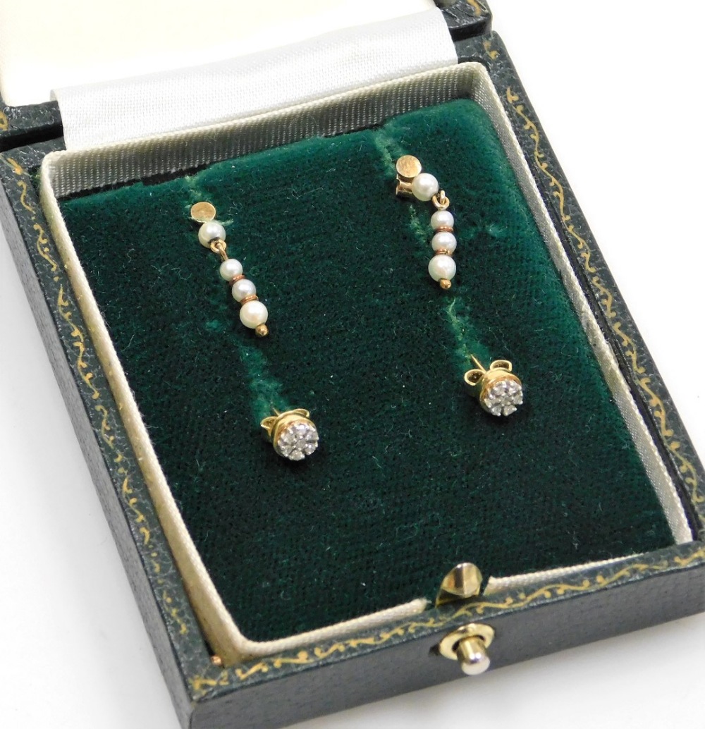 Two pairs of earrings, comprising a pair of small 9ct gold diamond cluster earrings each set with se