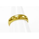 A 22ct gold wedding band, of plain design with makers stamp JG, ring size N½, 6g.