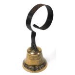 A Victorian brass servants or shop bell, with cast iron hanging loop, engraved number 7.