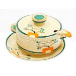 A Clarice Cliff Bizarre Ravel pattern sauce tureen and cover, ladle and stand, each piece hand paint